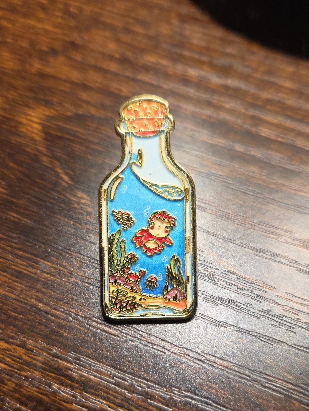 Gold-Trim Enamel Bottle Pin with Blue Underwater Scene